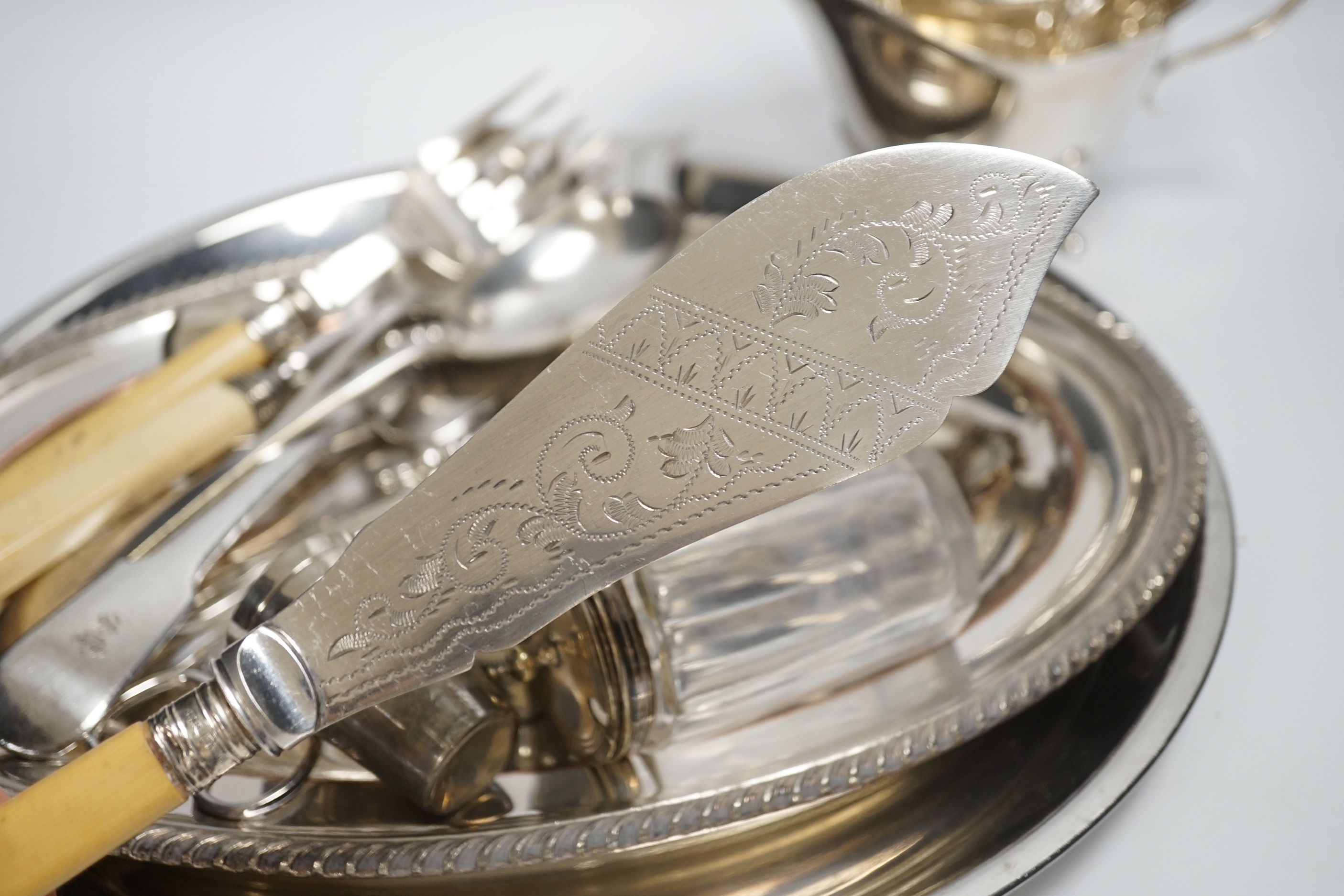 A small quantity of silver plate, two sauce boats, spirit labels, circular tray, etc.